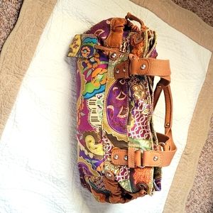 Fossil Purse beautiful colorful with pockets on each side, leather straps.